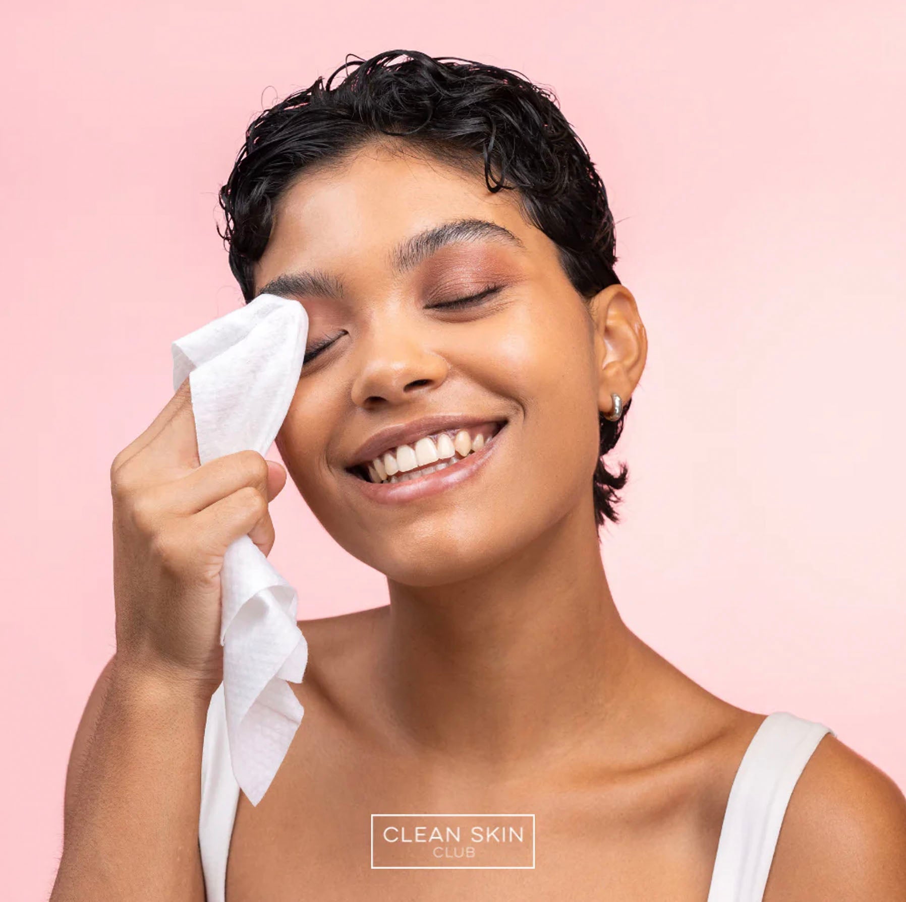 woman using Clean Skin Club Wipes on eyes