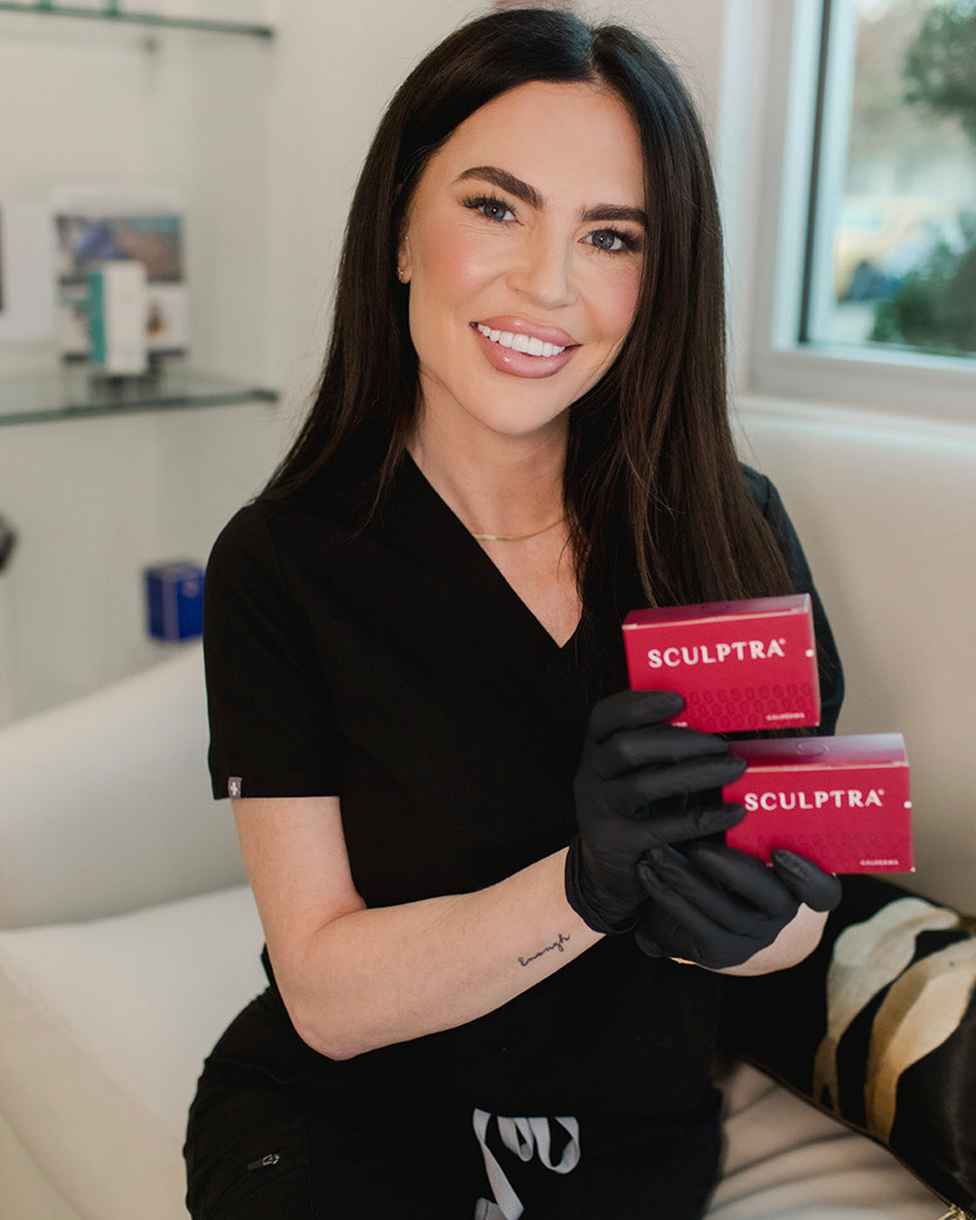 revay plunkett of revay aesthetics holding boxes of sculptra injectables