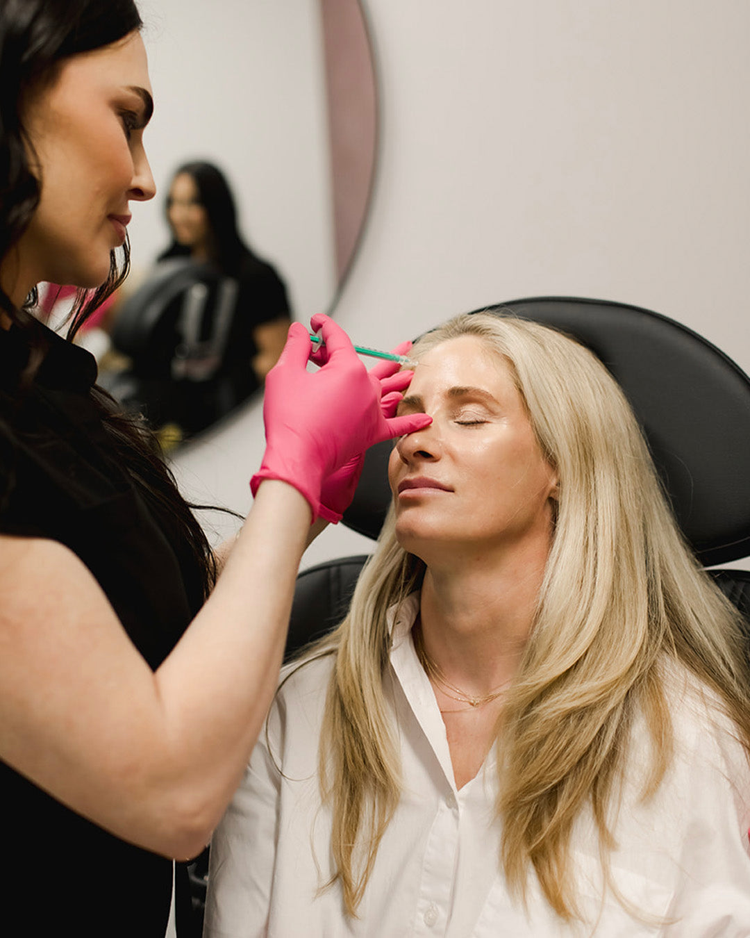 woman receiving forehead botox from Revay Aesthetics