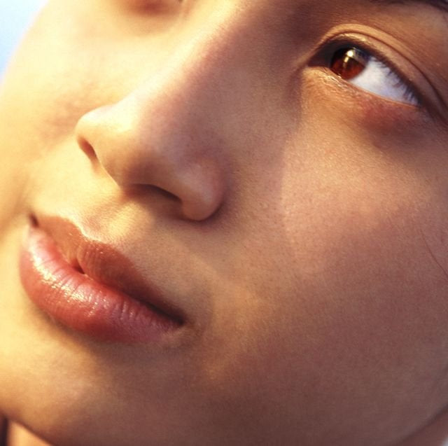 close up of a woman smiling with flawless skin