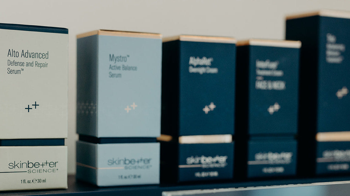 flat lay of skinbetter product shots, including alpharet overnight cream, alpharet peeling pads, intensive overnight cream, eyemax overnight cream, and alpharet clearing serum