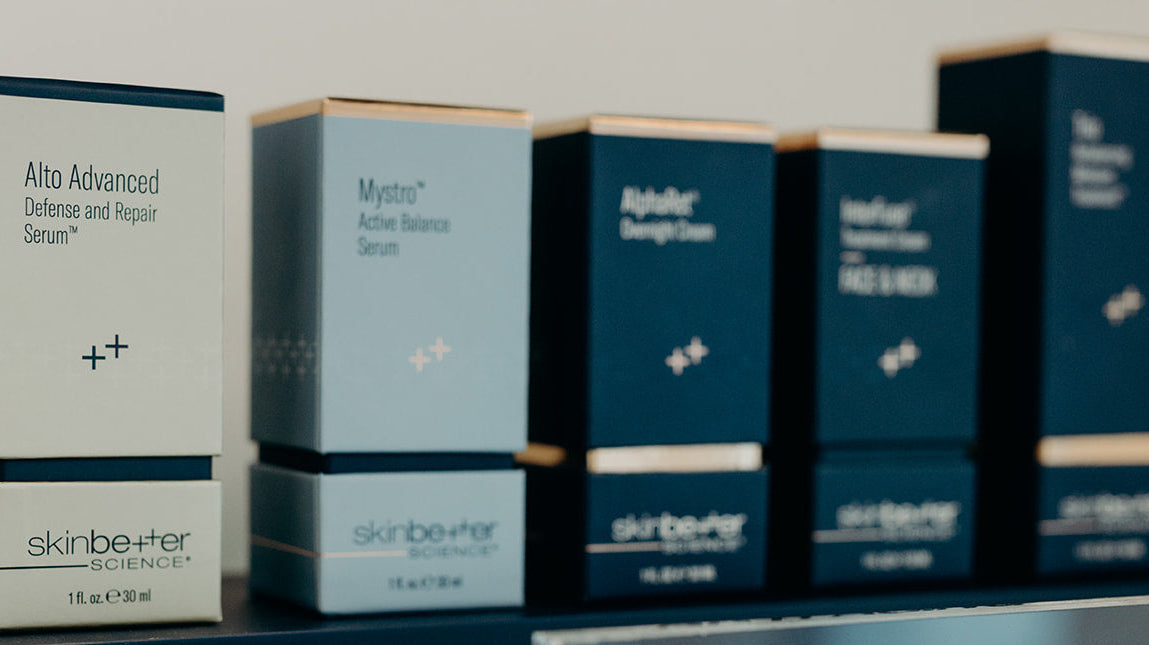 flat lay of skinbetter product shots, including alpharet overnight cream, alpharet peeling pads, intensive overnight cream, eyemax overnight cream, and alpharet clearing serum