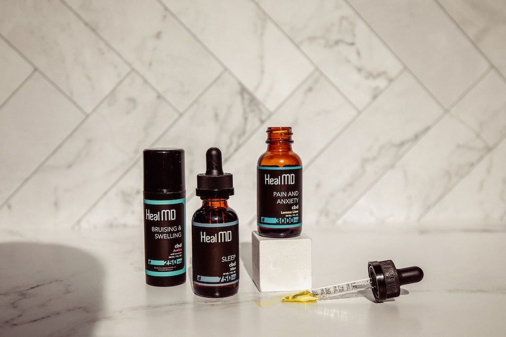 product shot of Heal MD bruising cream, Sleep CBD dropper and Pain and Anxiety CBD dropper