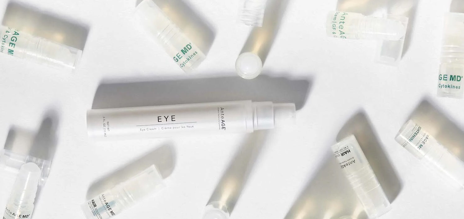 flat lay of anteage microneedling dermal roller and two vials of stem cells with cytokines 