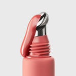 close-up of AN-GLOSS Ceramide Berry Crumble Lip Tint coming out of the tube