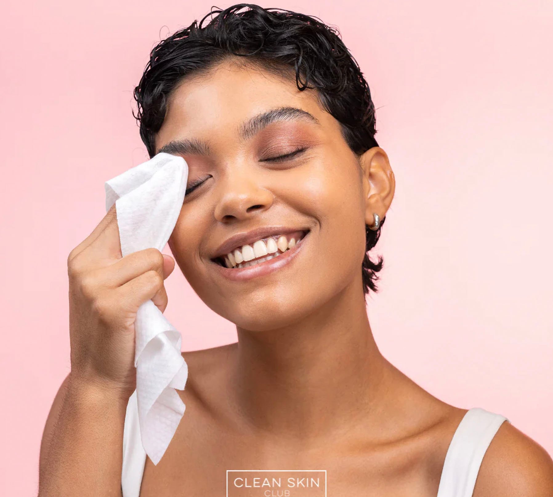 woman using Clean Skin Club Wipes on eyes