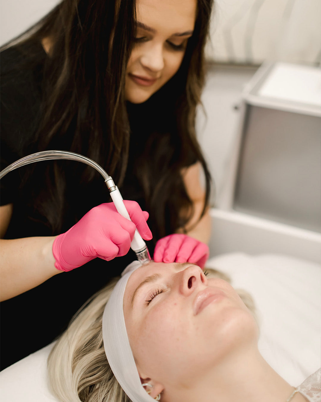 woman receiving diamond glow microdermabrasion facial from Revay Aesthetics